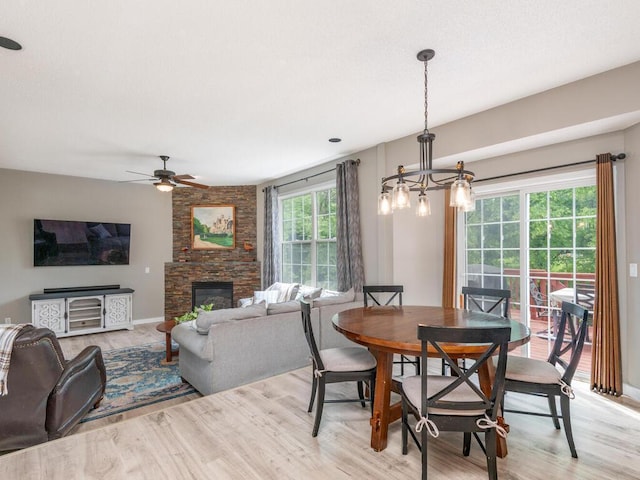 15000 Bridgewater Dr, Savage, MN 55378 - dining room with a ceiling fan, light wood-style flooring, and a fireplace