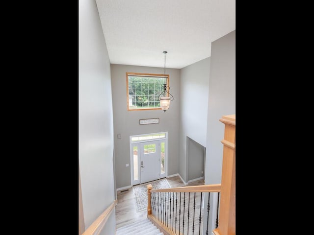 15000 Bridgewater Dr, Savage, MN 55378 - entrance foyer featuring light wood-type flooring and a chandelier