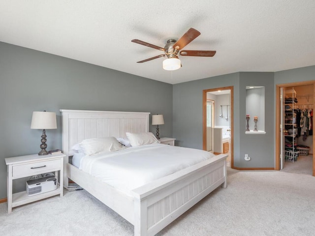 15000 Bridgewater Dr, Savage, MN 55378 - bedroom featuring a walk in closet, carpet floors, a closet, ensuite bath, and a textured ceiling