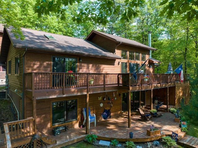 1147 Hillside Ln, Edgewater, WI 54817 - back of house featuring a wooden deck and roof with shingles