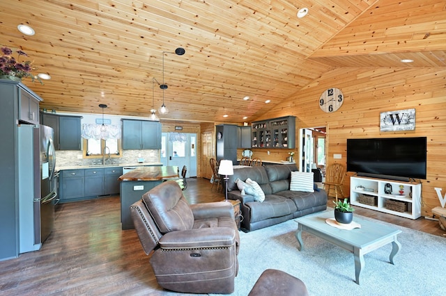 1147 Hillside Ln, Edgewater, WI 54817 - living room with wood ceiling, wooden walls, dark wood-style flooring, and high vaulted ceiling