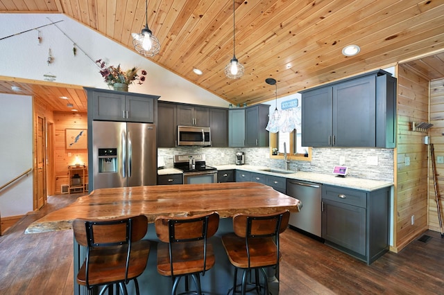 1147 Hillside Ln, Edgewater, WI 54817 - kitchen featuring stainless steel appliances, wood ceiling, a sink, vaulted ceiling, and backsplash