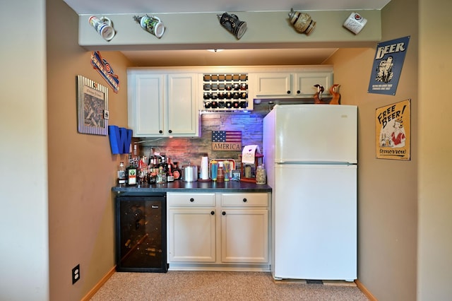 1147 Hillside Ln, Edgewater, WI 54817 - indoor dry bar featuring freestanding refrigerator, beverage cooler, backsplash, baseboards, and light colored carpet