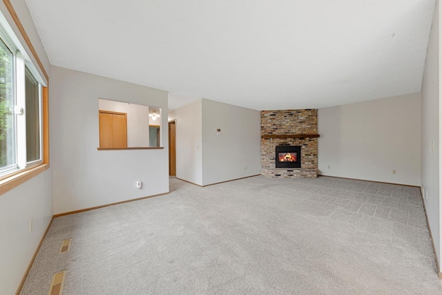 5214 148th St W, Apple Valley, MN 55124 - unfurnished living room featuring light colored carpet and a fireplace