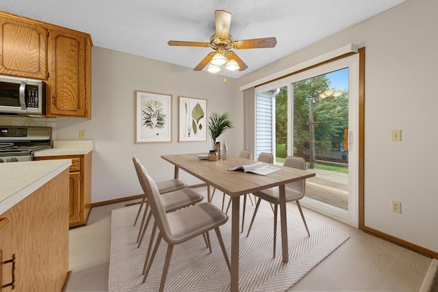 5214 148th St W, Apple Valley, MN 55124 - dining room with a ceiling fan and light colored carpet