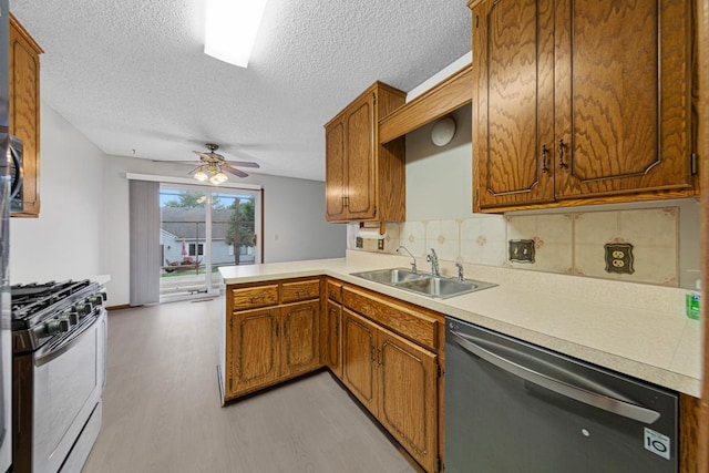 5214 148th St W, Apple Valley, MN 55124 - kitchen featuring stainless steel appliances, light wood-type flooring, light countertops, a textured ceiling, and ceiling fan