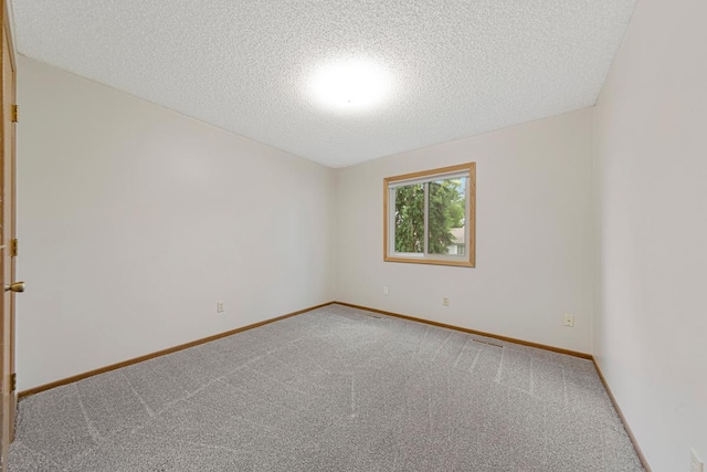 5214 148th St W, Apple Valley, MN 55124 - carpeted spare room featuring a textured ceiling and baseboards