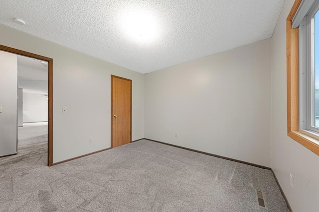 5214 148th St W, Apple Valley, MN 55124 - carpeted empty room with a textured ceiling and a smoke detector