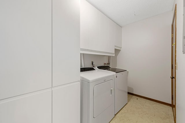 5214 148th St W, Apple Valley, MN 55124 - laundry area with cabinet space, washing machine and clothes dryer, and a textured ceiling