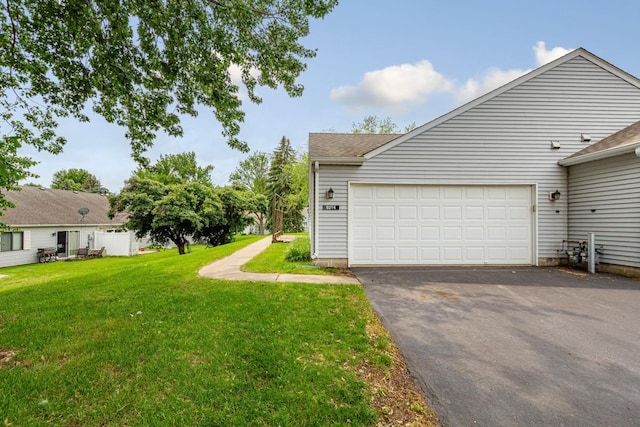 5214 148th St W, Apple Valley, MN 55124 - view of green lawn with driveway and an attached garage
