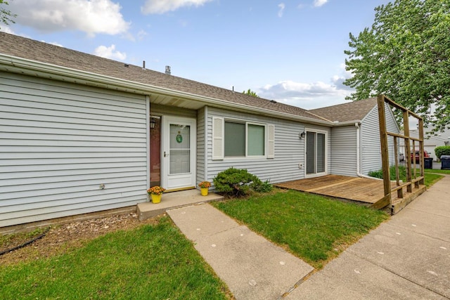 5214 148th St W, Apple Valley, MN 55124 - view of front of home with a wooden deck, a front yard, and a shingled roof