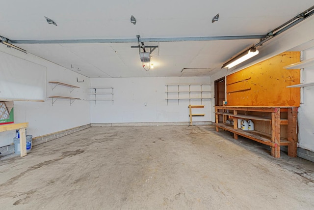 5214 148th St W, Apple Valley, MN 55124 - garage featuring a workshop area and a garage door opener