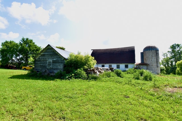 67433 325th St, Watkins, MN 55389 - view of green lawn featuring an outbuilding and a barn