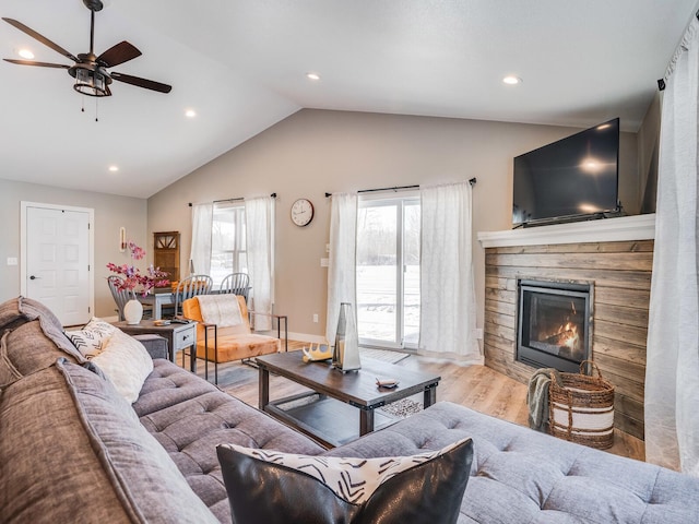 2855 28 11/16 St, Cedar Lake Twp, WI 54817 - living area with plenty of natural light, a ceiling fan, lofted ceiling, wood finished floors, and a fireplace