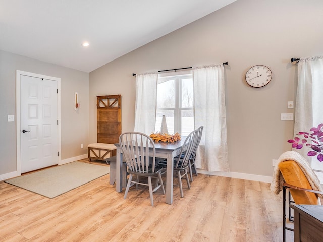 2855 28 11/16 St, Cedar Lake Twp, WI 54817 - dining space with vaulted ceiling, light wood-style flooring, and baseboards