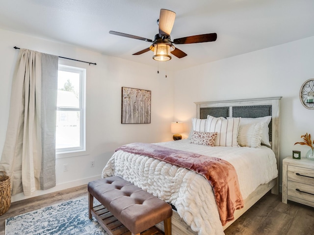 2855 28 11/16 St, Cedar Lake Twp, WI 54817 - bedroom with wood finished floors, baseboards, and ceiling fan