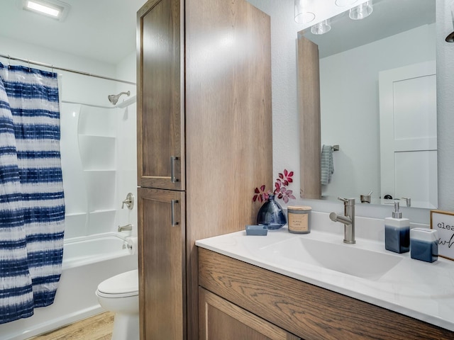 2855 28 11/16 St, Cedar Lake Twp, WI 54817 - bathroom with vanity, toilet, wood finished floors, and shower / tub combo