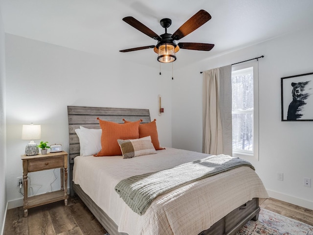 2855 28 11/16 St, Cedar Lake Twp, WI 54817 - bedroom with wood finished floors, baseboards, and a ceiling fan