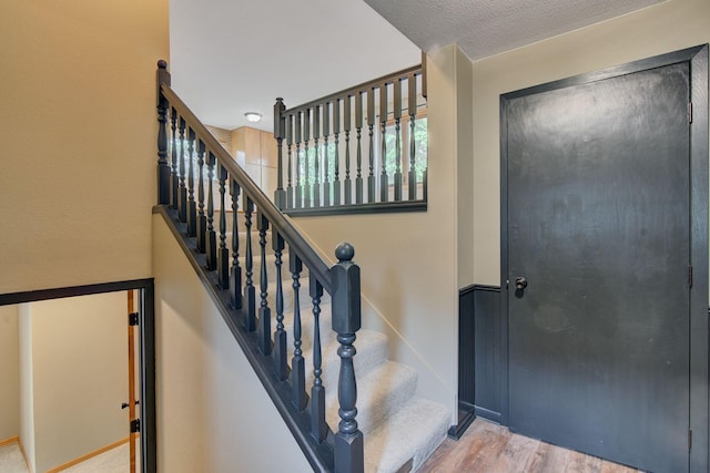 407 4th Ave NE, Kasson, MN 55944 - staircase featuring wood finished floors