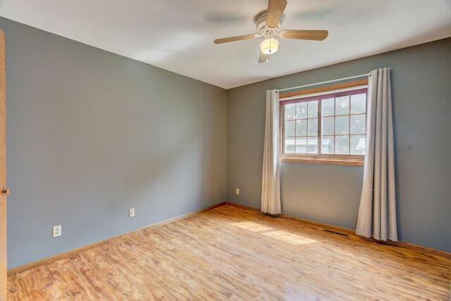407 4th Ave NE, Kasson, MN 55944 - empty room featuring ceiling fan and wood finished floors
