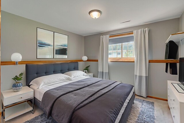 407 4th Ave NE, Kasson, MN 55944 - bedroom featuring light carpet and baseboards