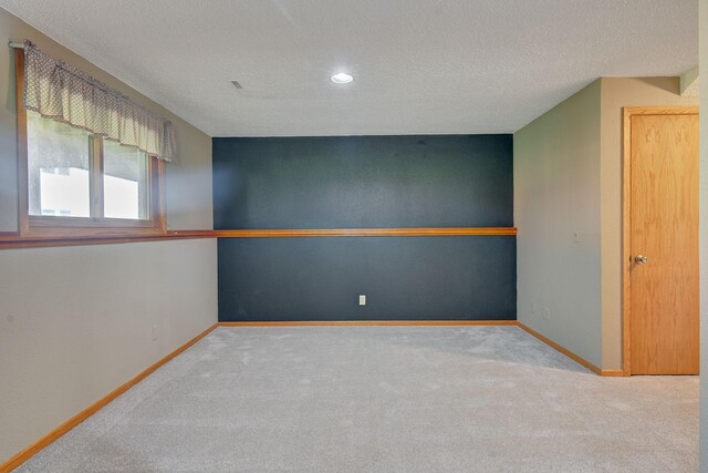 407 4th Ave NE, Kasson, MN 55944 - carpeted empty room featuring a textured ceiling and recessed lighting