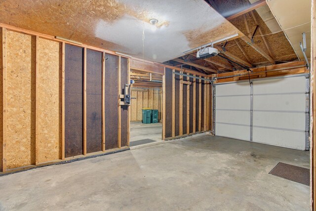 407 4th Ave NE, Kasson, MN 55944 - garage featuring a garage door opener