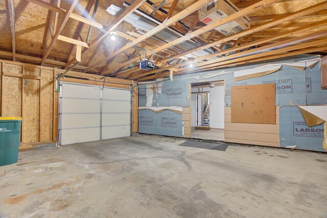 407 4th Ave NE, Kasson, MN 55944 - garage featuring a garage door opener