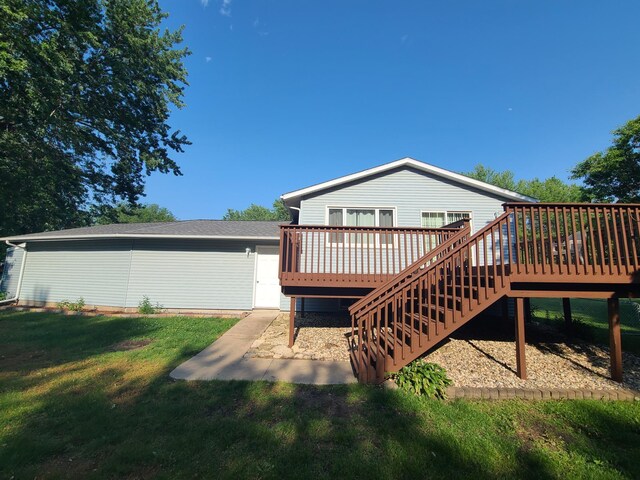 407 4th Ave NE, Kasson, MN 55944 - rear view of house featuring a deck, a lawn, stairs, and a patio area