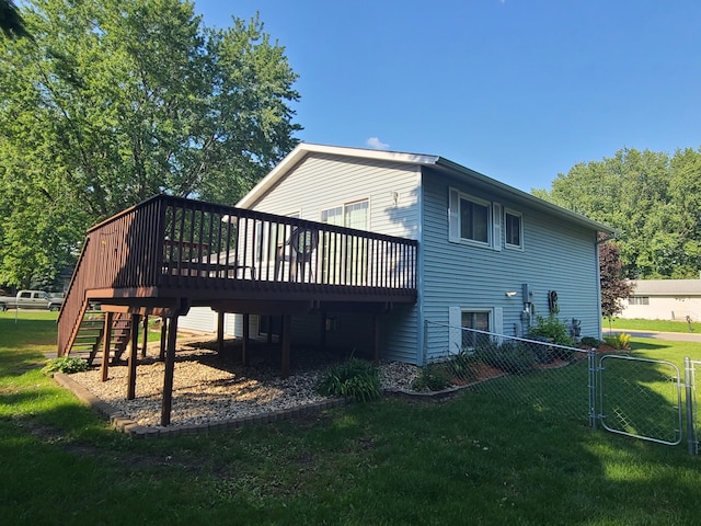 407 4th Ave NE, Kasson, MN 55944 - rear view of house featuring a wooden deck, stairs, and a gate