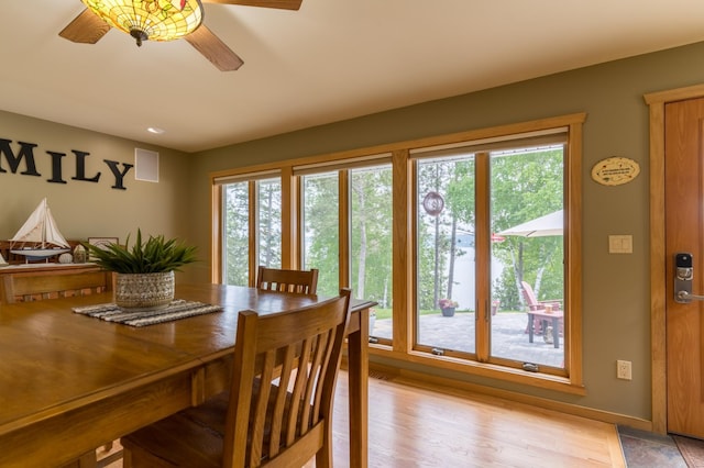 27766 County 37, Laporte, MN 56461 - dining area with healthy amount of natural light, a ceiling fan, light wood-type flooring, and baseboards