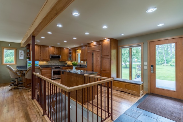 27766 County 37, Laporte, MN 56461 - kitchen featuring high quality appliances, dark countertops, brown cabinetry, recessed lighting, and healthy amount of natural light