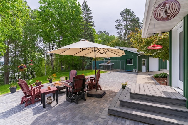 27766 County 37, Laporte, MN 56461 - view of patio / terrace with a fire pit