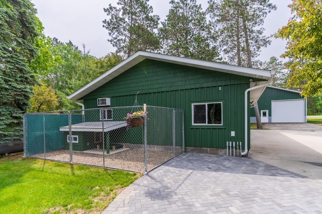 27766 County 37, Laporte, MN 56461 - view of front of property featuring board and batten siding, a garage, and an outdoor structure
