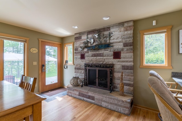 27766 County 37, Laporte, MN 56461 - living room with wood finished floors, plenty of natural light, a stone fireplace, and recessed lighting