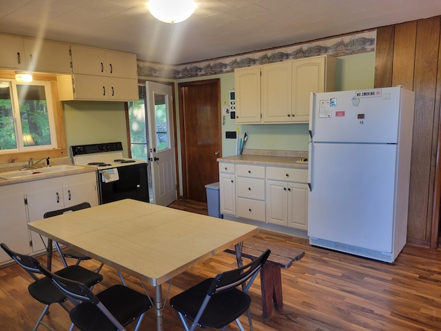 1981 Long Lake Ln, Johnstown Twp, WI 54826 - kitchen with freestanding refrigerator, a sink, electric range, dark wood-type flooring, and light countertops