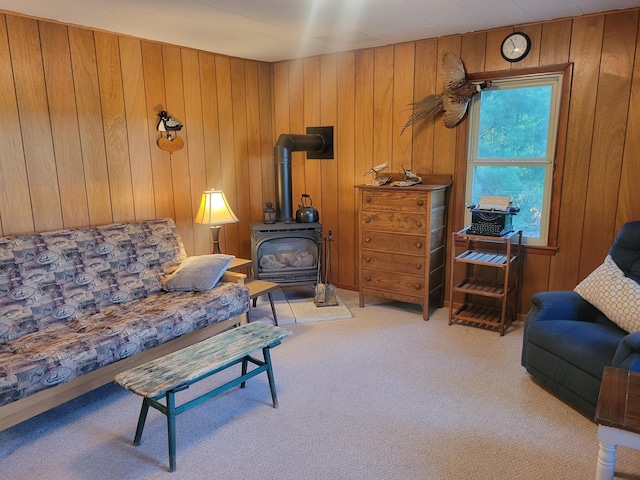 1981 Long Lake Ln, Johnstown Twp, WI 54826 - living area featuring carpet flooring, a wood stove, and wood walls
