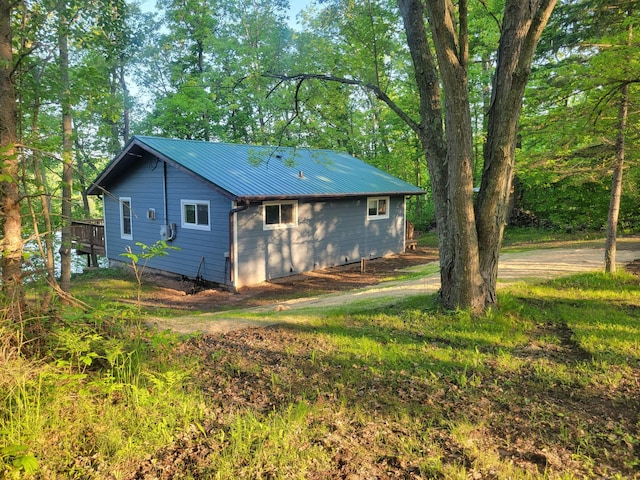 1981 Long Lake Ln, Johnstown Twp, WI 54826 - view of side of property featuring metal roof and a wooden deck