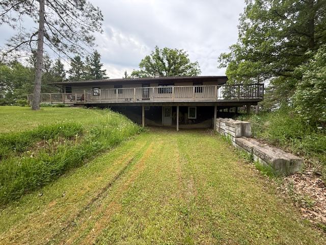 20501 Nebish Rd NE, Blackduck, MN 56630 - back of house featuring a deck and a yard