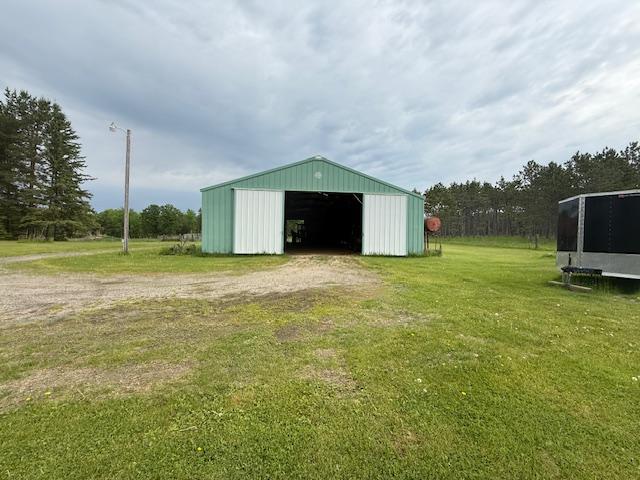 20501 Nebish Rd NE, Blackduck, MN 56630 - view of pole building with a yard and dirt driveway