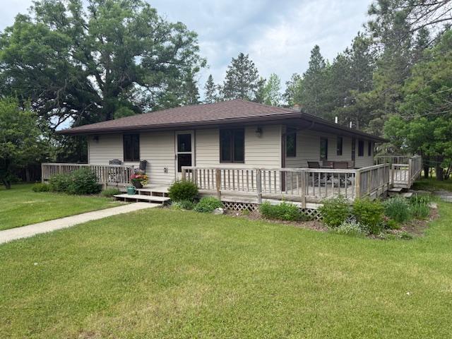 20501 Nebish Rd NE, Blackduck, MN 56630 - rear view of house with a yard and a wooden deck