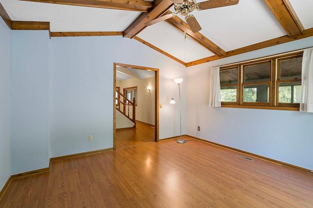 11606 235th St E, Lakeville, MN 55044 - unfurnished room with ceiling fan, wood finished floors, baseboards, and stairway