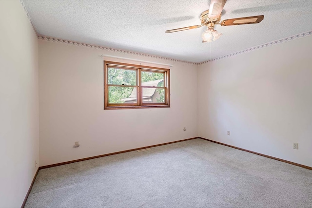 11606 235th St E, Lakeville, MN 55044 - unfurnished room featuring carpet floors, a textured ceiling, ceiling fan, and baseboards