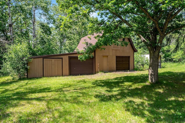 11606 235th St E, Lakeville, MN 55044 - view of green lawn featuring a garage and an outdoor structure