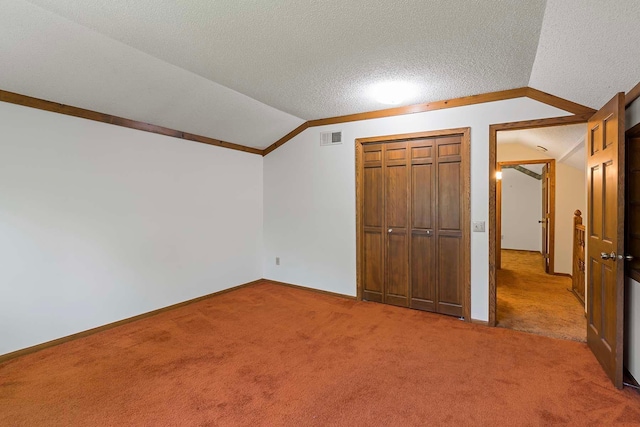 11606 235th St E, Lakeville, MN 55044 - unfurnished bedroom with vaulted ceiling, light carpet, a textured ceiling, a closet, and baseboards