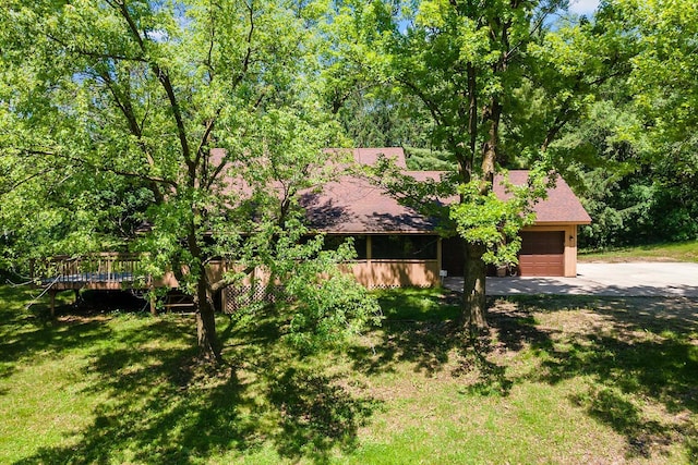 11606 235th St E, Lakeville, MN 55044 - obstructed view of property featuring an attached garage, concrete driveway, a front yard, roof with shingles, and a deck