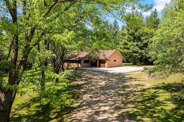 11606 235th St E, Lakeville, MN 55044 - view of property hidden behind natural elements with driveway and a garage