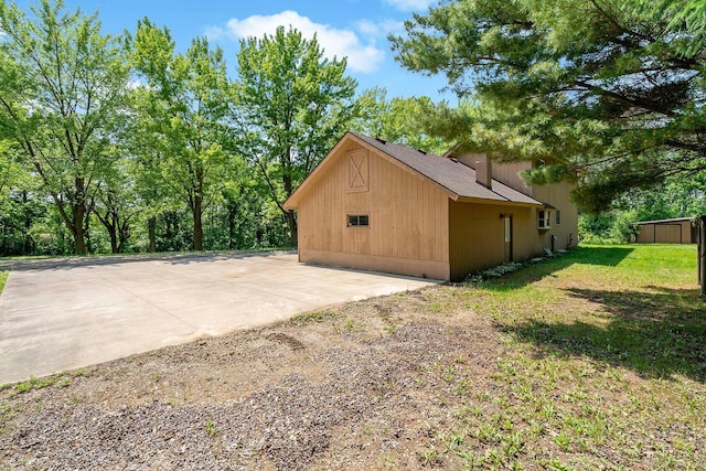 11606 235th St E, Lakeville, MN 55044 - view of property exterior featuring a lawn
