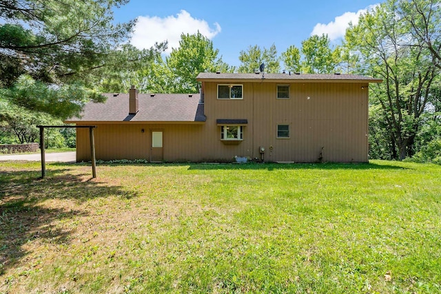 11606 235th St E, Lakeville, MN 55044 - rear view of property featuring a lawn and roof with shingles