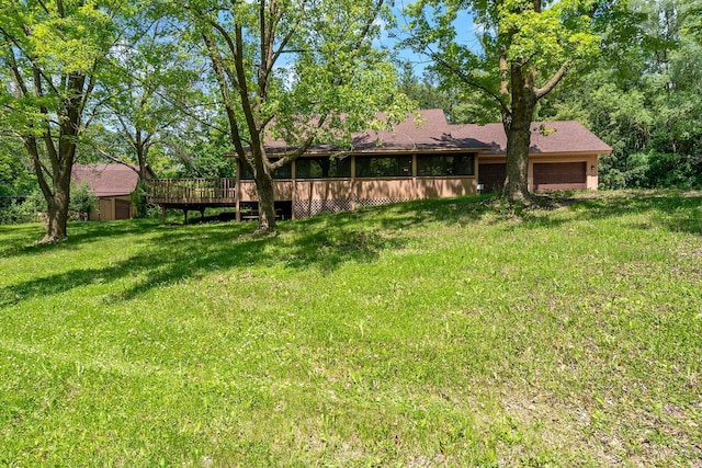 11606 235th St E, Lakeville, MN 55044 - view of grassy yard featuring an attached garage and a deck